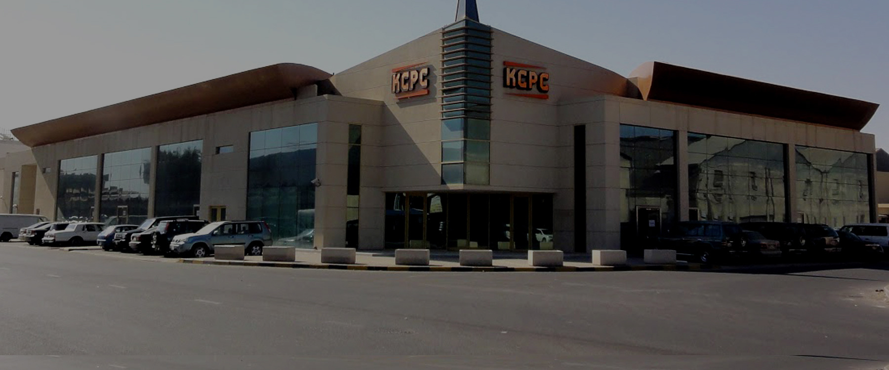 KCPC corporate building exterior with company tagline - KCPC
